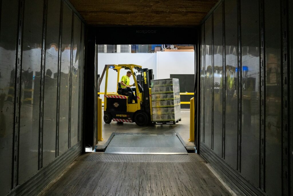 Warehouse worker handling freight with a forklift