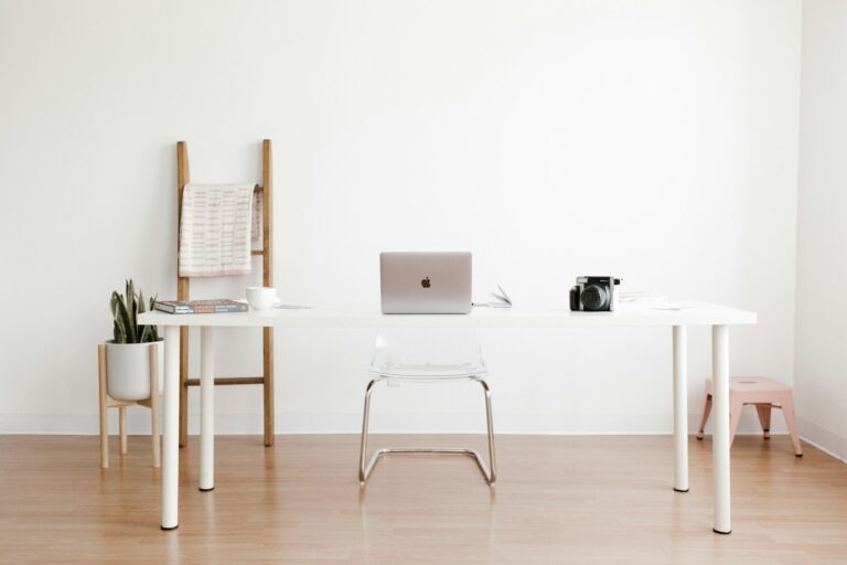Laptop on a desk in a bright office workspace