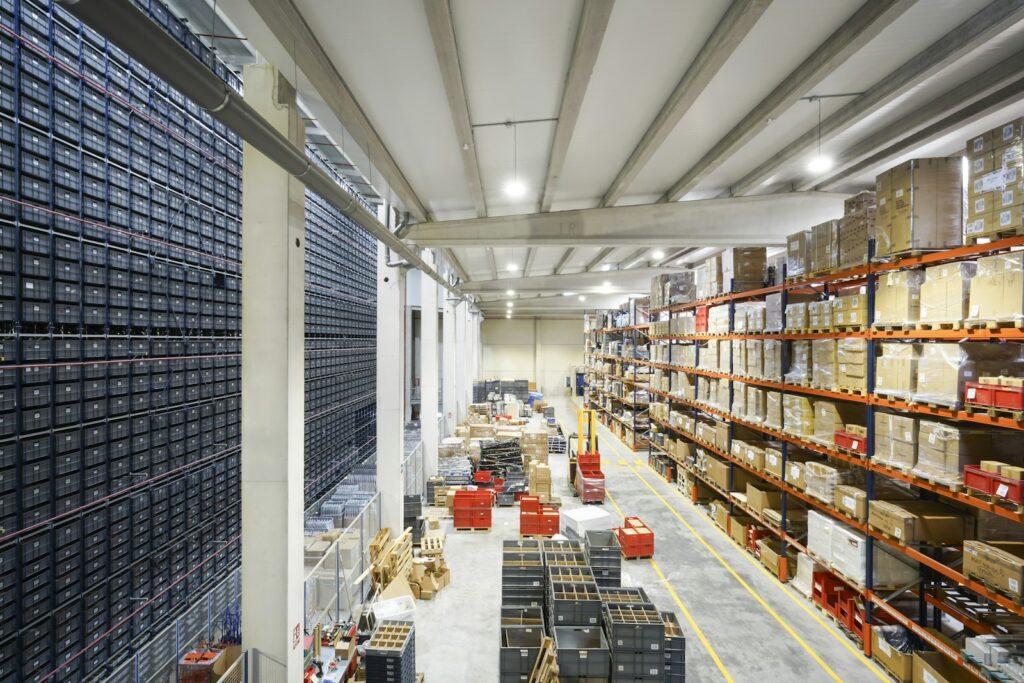 Pallets and boxes stored inside a large warehouse